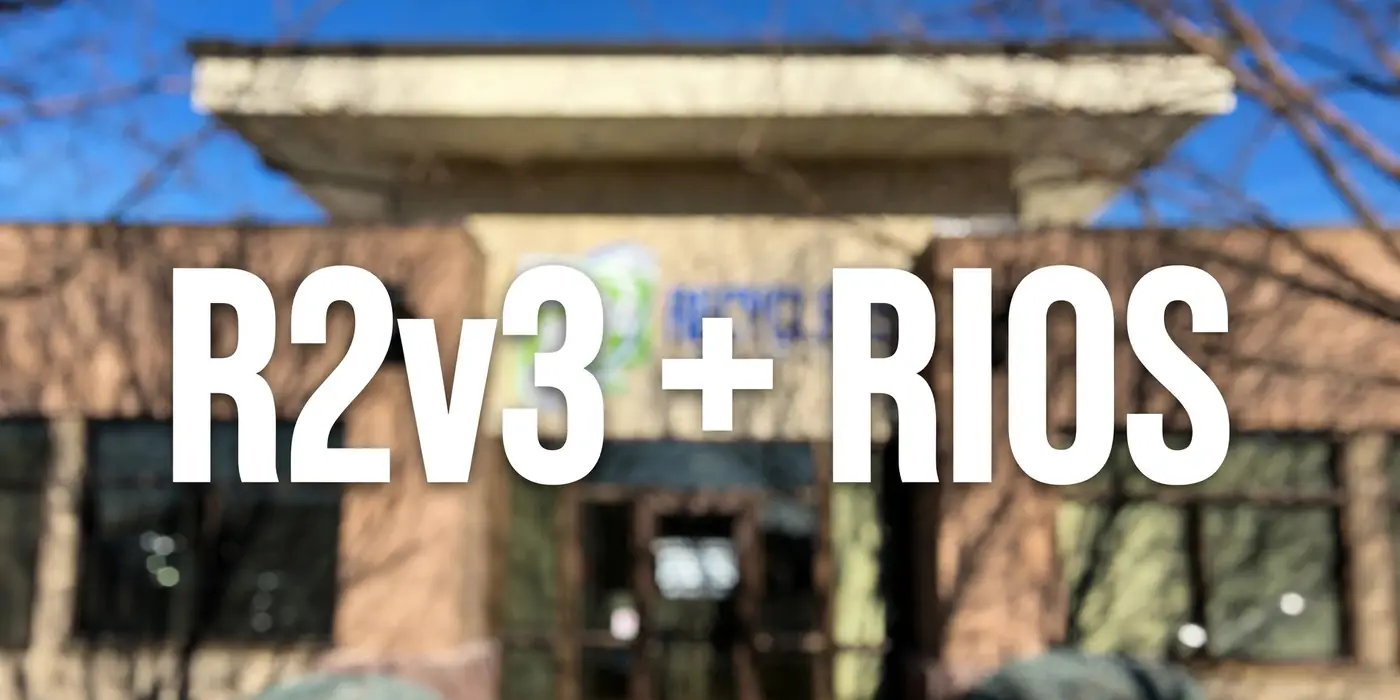 Blurred photo of the PC Recyclers of Idaho building with R2v3 + RIOS text overlay