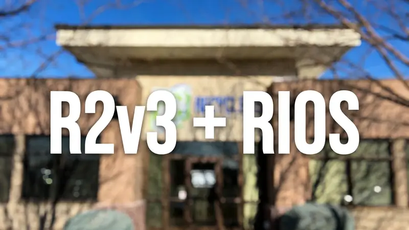 Blurred photo of the PC Recyclers of Idaho building with R2v3 + RIOS text overlay